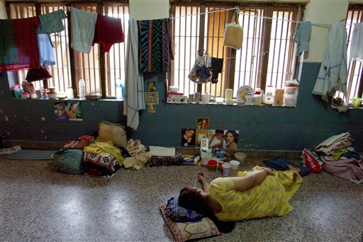 An in-law accused of dowry crimes sleep at a communal cell in Tihar Jail's dowry wing, in Asia's largest prison in New Delhi, India. An Indian report released in August 2013, says a woman dies every hour in disputes over how much her family has paid in dowry to the groom for her marriage. (AP)