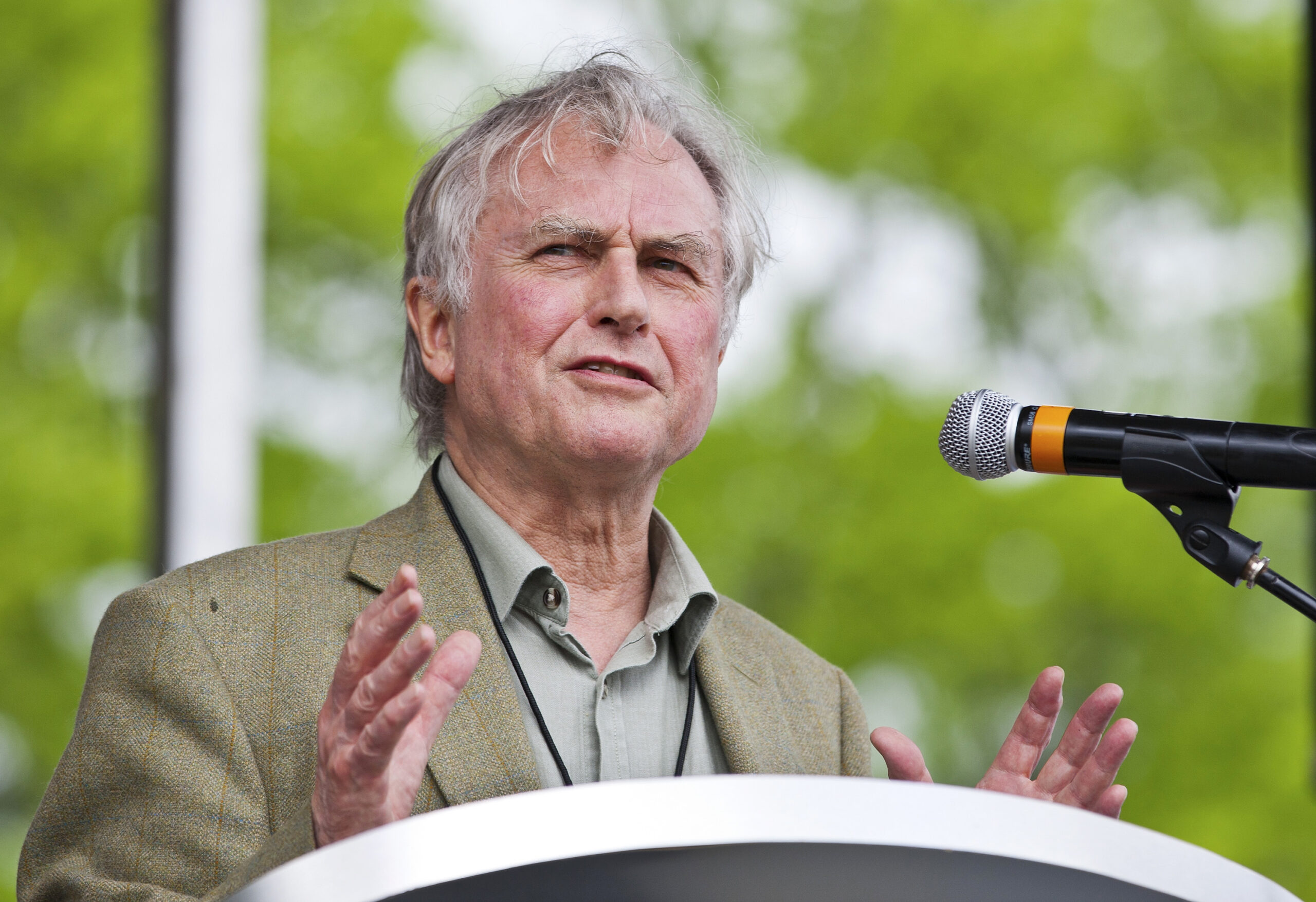 Well-known atheist and best-selling author Richard Dawkins speaks to the crowd during the "Rock Beyond Belief" festival at Fort Bragg army base in North Carolina March 31, 2012. The atheist-themed festival drew hundreds of people to Fort Bragg on Saturday for what was believed to be the first-ever event held on a U.S. military base for service members who do not have religious beliefs. Organizers said they hoped the "Rock Beyond Belief" event at Fort Bragg would spur equal treatment toward nonbelievers in the armed forces and help lift the stigma for approximately 295,000 active duty personnel who consider themselves atheist, agnostic or without a religious preference. REUTERS/Chris Keane (UNITED STATES - Tags: MILITARY RELIGION SOCIETY) - RTR306JY (Reuters)