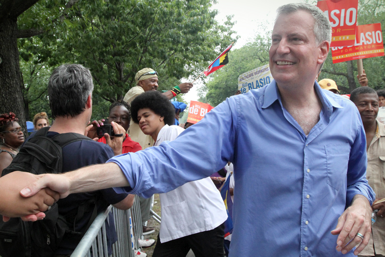 Bill de Blasio shakes hands with spectators at the West Indian Day Parade, Sept. 2, 2013. (AP/Tina Fineberg)