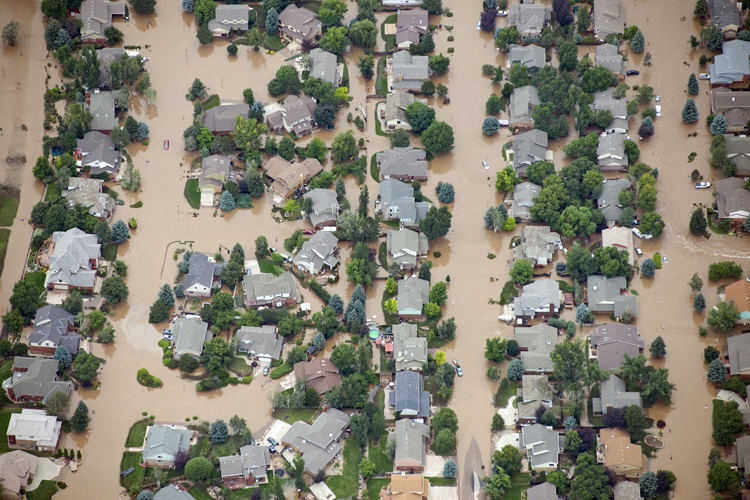 Homes in residential neighborhood in Longmont, Colo., are submerged as flooding continues to devastate the Front Range and thousands are forced to evacuate with an unconfirmed number of structures destroyed, Friday, Sept. 13, 2013. (AP/John Wark)