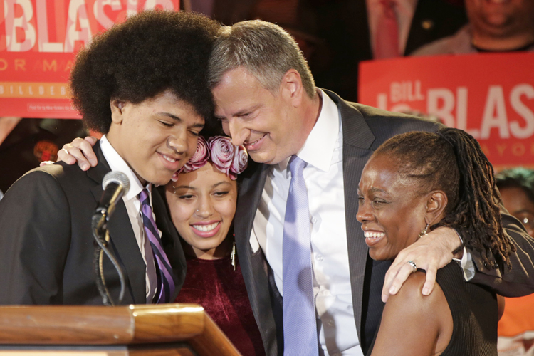 Bill De Blasio embraces his family (AP/Kathy Willens)