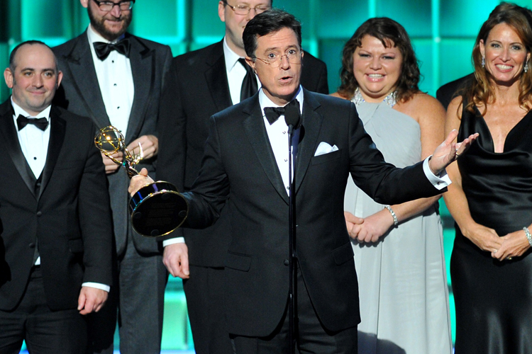 Stephen Colbert, center, and cast and crew of "The Colbert Report" (AP/Vince Bucci)