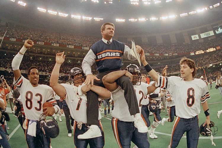 Mike Ditka is carried off the field by his players after the Bears win Super Bowl XX in New Orleans, La., Jan. 26, 1986. (AP/Phil Sandlin)