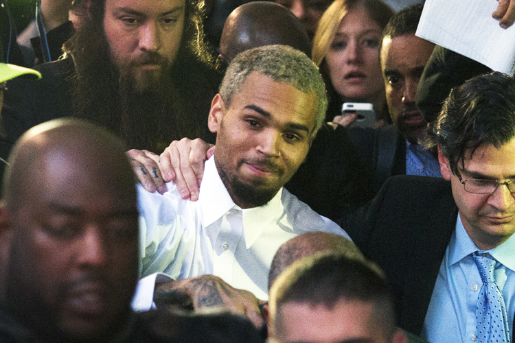 Chris Brown departs the H. Carl Moultriel courthouse Monday, Oct. 28, 2013, in Washington. (AP/Cliff Owen)