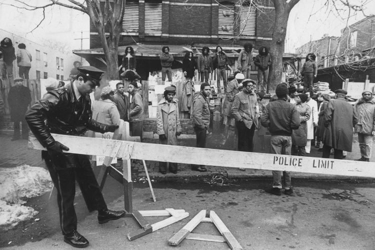 MOVE members and police during the 1978 confrontation outside MOVE headquarters, in a still from "Let the Fire Burn." (Zeitgeist Films)
