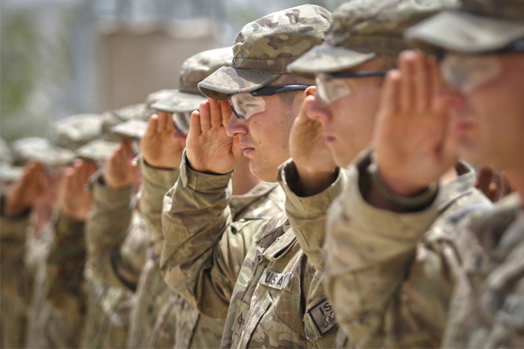 Soldiers salute during the Memorial Day ceremony (Reuters/Danish Siddiqui)