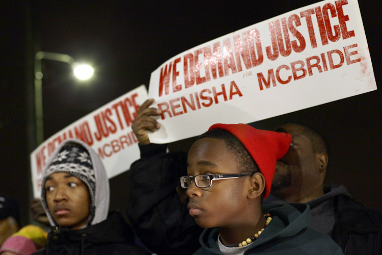 Demonstrators protest the killing of 19-year-old Renisha McBride outside Dearborn Heights Police Station in Dearborn Heights, Michigan November 7, 2013. (Reuters/Joshua Lott)