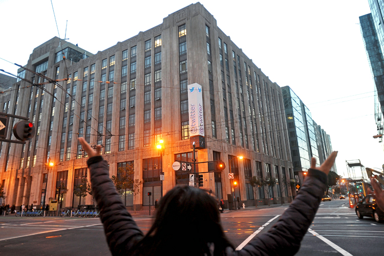 A protester outside Twitter's headquarters on Nov. 7, 2013, in San Francisco. (AP/Noah Berger)