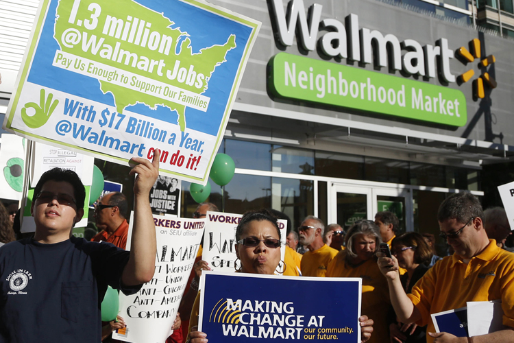 Protesters gather outside a Wal-Mart Neighborhood Store for a peaceful demonstration Thursday, Sept. 5, 2013, in Chicago. (AP/Charles Rex Arbogast)