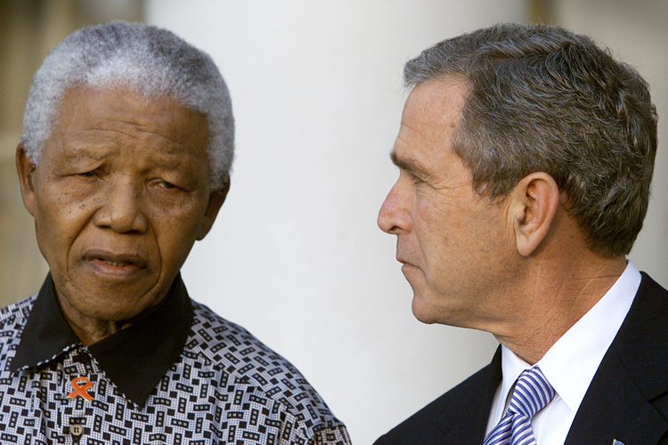 Nelson Mandela, George W. Bush (Reuters/Kevin Lamarque)