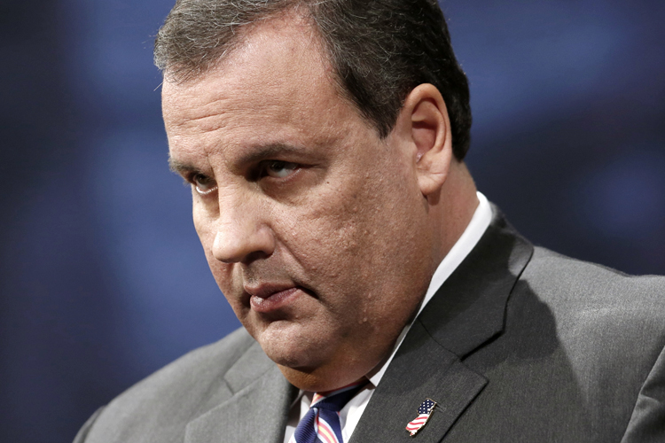 Chris Christie stands on stage before being sworn in for his second term as governor in Trenton, New Jersey, January 21, 2014. (Reuters/Lucas Jackson)