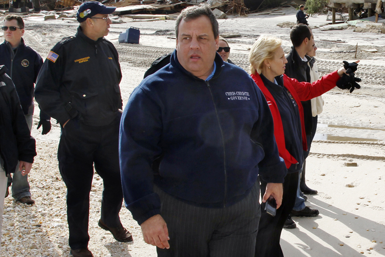 Chris Christie walks past homes devastated by Hurricane Sandy in Mantoloking, N.J., Nov. 2, 2012. (AP/Mel Evans)