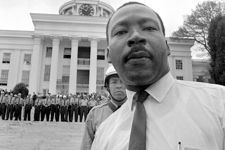 State troopers stand shoulder to shoulder on the steps of Alabama's State Capitol on March 25, 1965, barring Dr. Martin Luther King, Jr. from entering. (AP)
