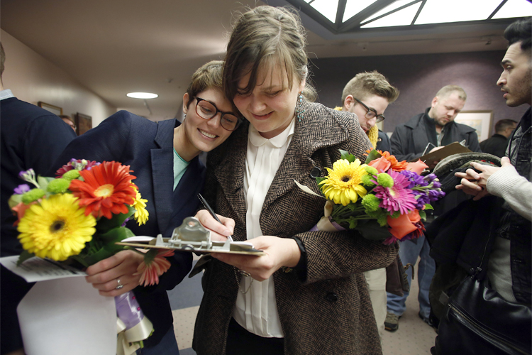 The author, left, with Nicole Christensen as they wait to get married at the Salt Lake County Clerk's office on Dec. 20, 2013. (Reuters/Jim Urquhart)