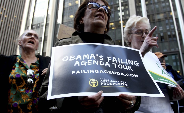 People attend an Americans for Prosperity rally in New York, (Associated Press)