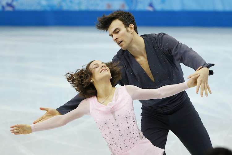Meagan Duhamel and Eric Radford of Canada compete during the Team Pairs Short Program at the Sochi 2014 Winter Olympics, February 6, 2014. (Reuters/Brian Snyder)
