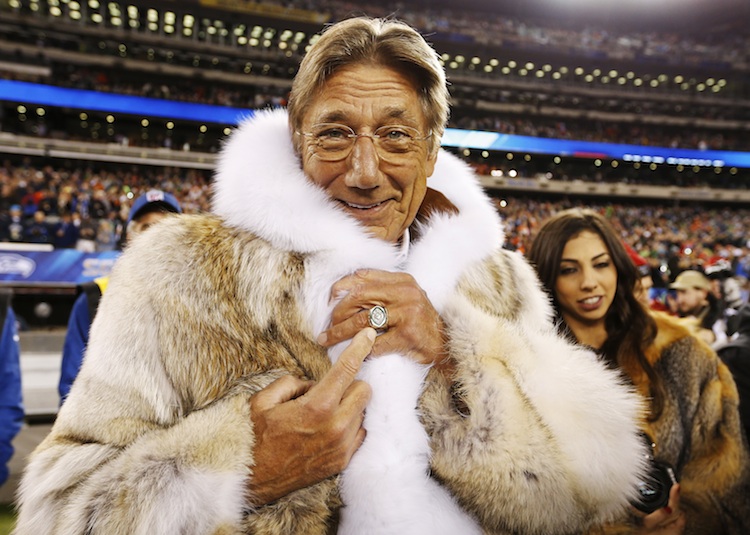 Former New York Jets quarterback Joe Namath points to his championship ring before the Seattle Seahawks play the Denver Broncos in the NFL Super Bowl XLVIII. (REUTERS/Carlo Allegri)