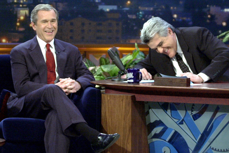 George W. Bush laughs during an appearance on "The Tonight Show with Jay Leno" on March 6, 2000. (AP/Eric Draper)