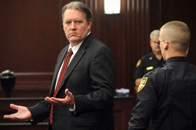 Michael Dunn reacts after the verdict is read in Jacksonville, Fla., Saturday, Feb. 15, 2014. Dunn was convicted of attempted murder in the shooting death of a teenager over an argument over loud music, but jurors could not agree on the most serious charge of first-degree murder. (The Florida Times-Union, Bob Mack, Pool) (AP/Bob Mack)