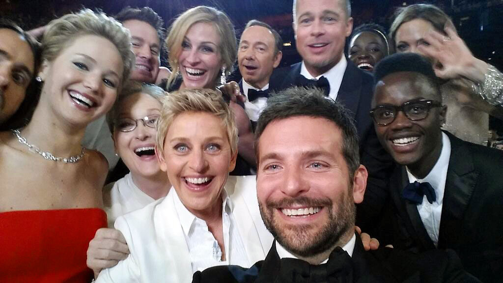 This image released by Ellen DeGeneres shows actors, front row from left, Jared Leto, Jennifer Lawrence, Meryl Streep, Ellen DeGeneres, Bradley Cooper, Peter Nyongo Jr. and, second row, from left, Channing Tatum, Julia Roberts, Kevin Spacey, Brad Pitt, Lupita Nyongo and Angelina Jolie as they pose for a "selfie" portrait on a cell phone during the Oscars at the Dolby Theatre on Sunday, March 2, 2014, in Los Angeles. (AP Photo/Ellen DeGeneres) (AP)