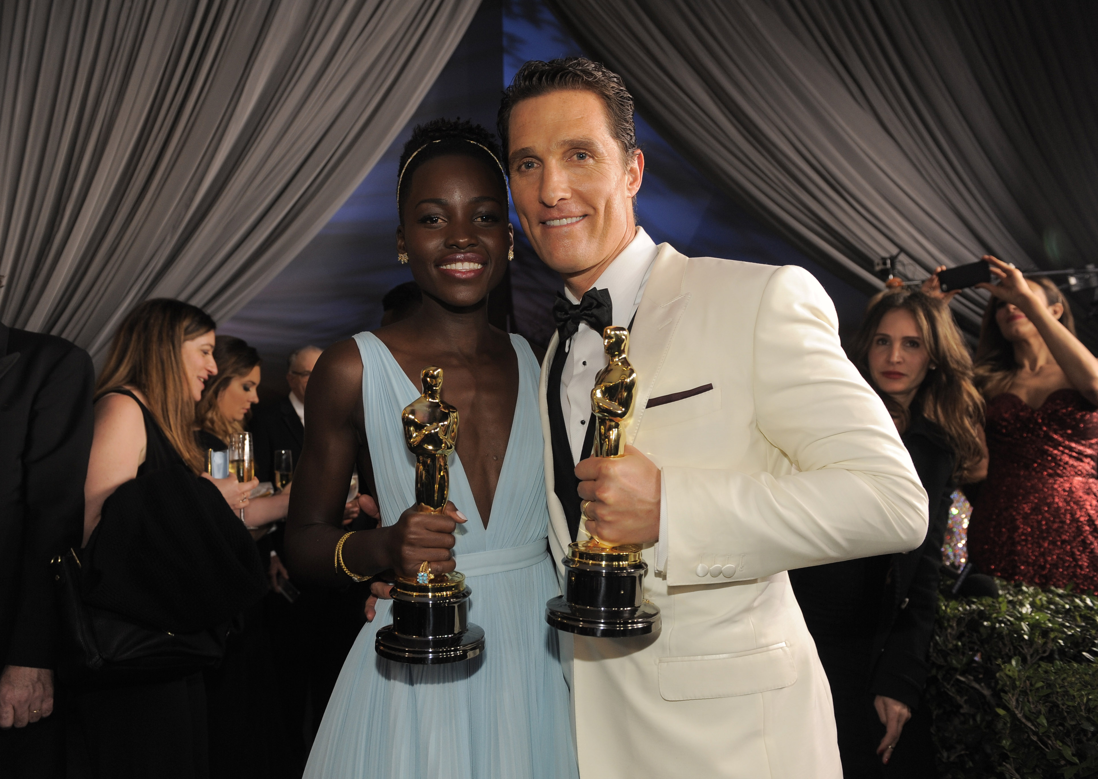 Lupita Nyong'o, winner of the award for best actress in a supporting role for "12 Years a Slave" and Matthew McConaughey winner of the award for best actor for his role in the "Dallas Buyers Club" attend the Governors Ball after the Oscars on Sunday, March 2, 2014, at the Dolby Theatre in Los Angeles.  (Photo by Chris Pizzello/Invision/AP) (Chris Pizzello/invision/ap)