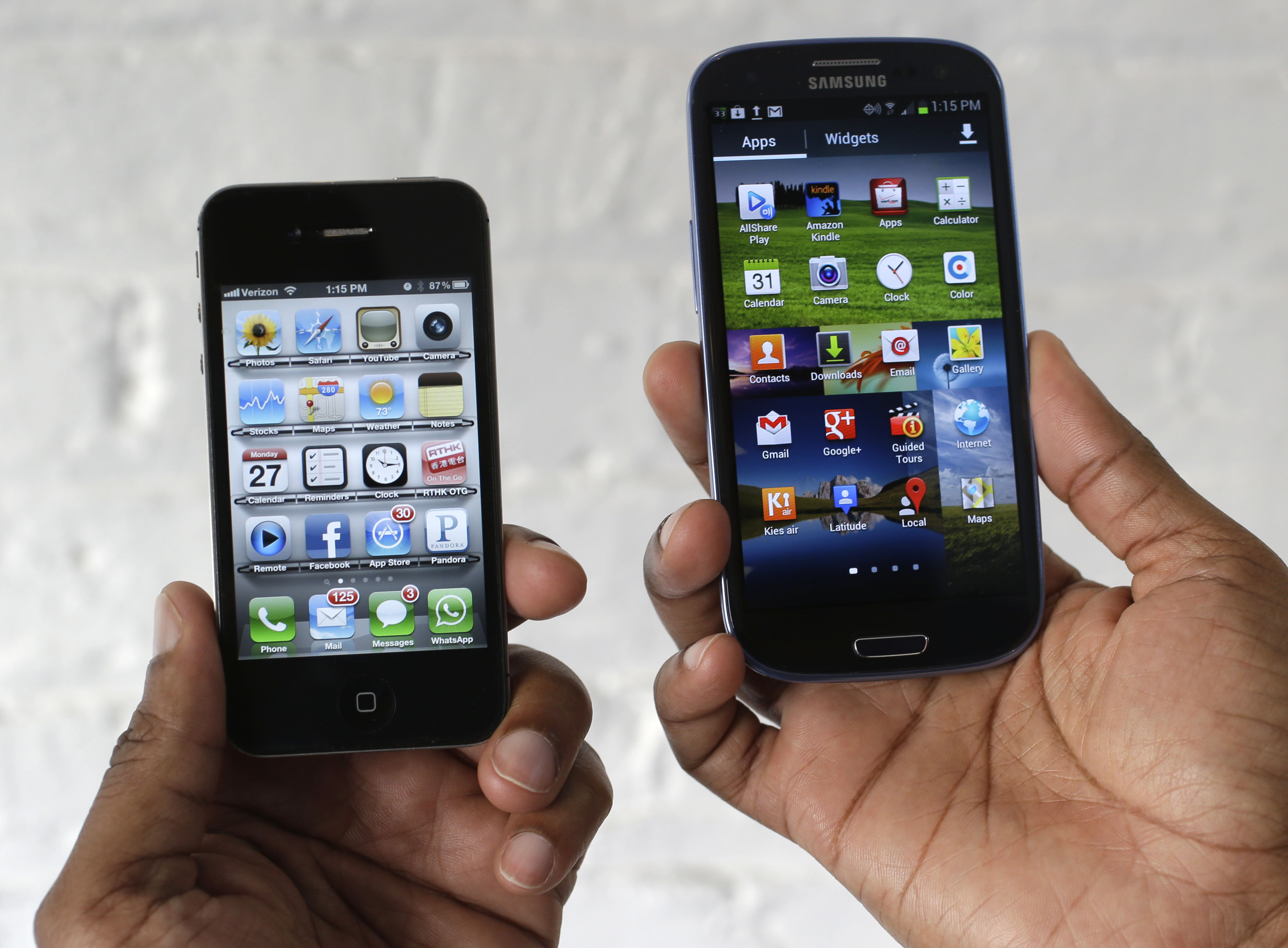 In this Aug. 27, 2012 photo, the Apple iPhone 4s, left, is displayed next to the Samsung Galaxy S III at a store in San Francisco. Apple already has won nearly $1 billion in judgments against Samsung over patent infringements involving older-model devices. Now Apple is alleging Samsungs newest devices, such as its Galaxy S III, also copied Apple technology. Jury selection for the case begins Monday, March 31, 2014. (AP Photo/Marcio Jose Sanchez) (AP)
