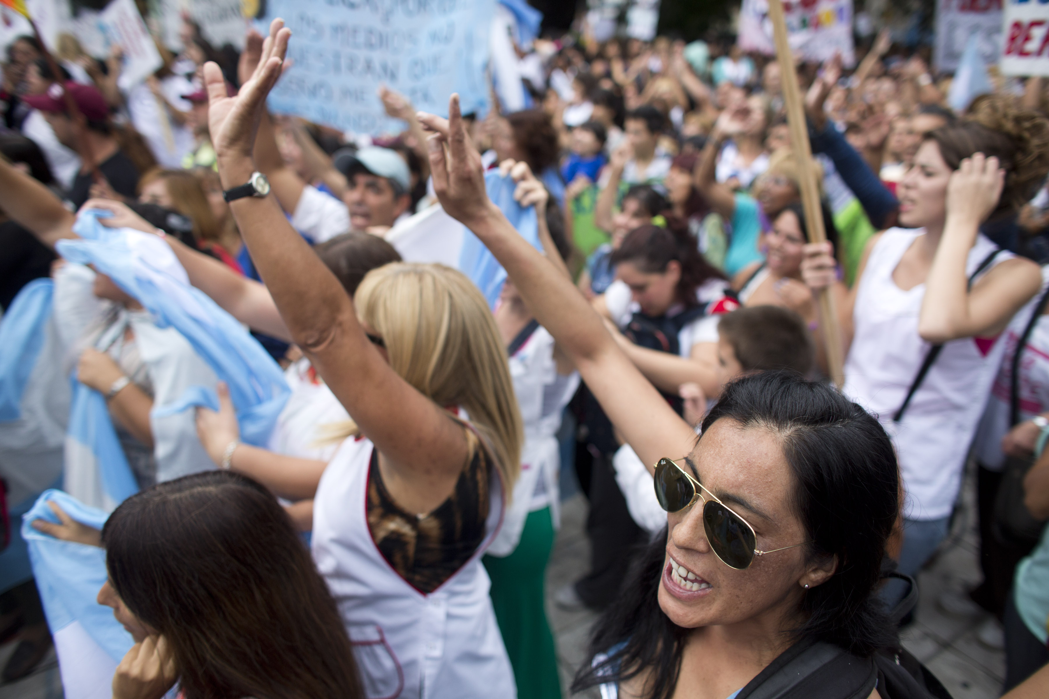 Teachers chant slogans during a demonstration in front of the Ministry of Education in Buenos Aires, Argentina, Wednesday, March 26, 2014. Striking teachers in the Buenos Aires province are demanding a wage increase higher than what is currently being offered by the provincial administration. The strike is in its 15th day, affecting more than 3 million students. (AP Photo/Victor R. Caivano) (AP)