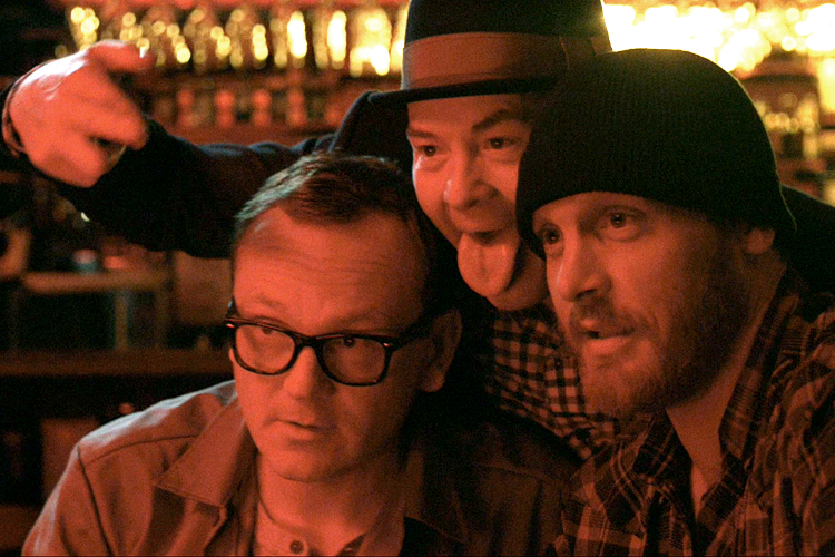 Pat Healy, David Koechner and Ethan Embry (L to R) in "Cheap Thrills."