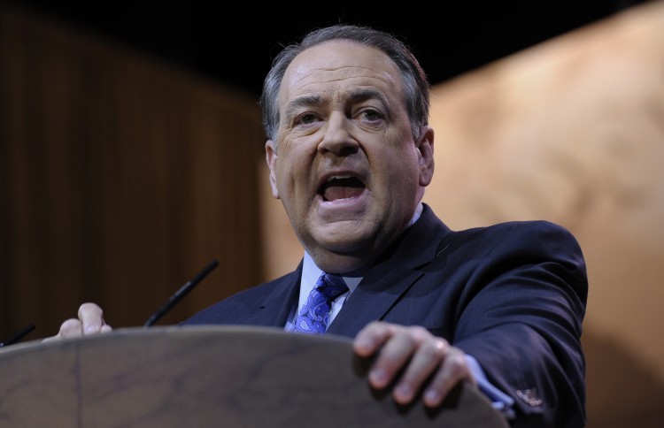 Former Arkansas Gov. Mike Huckabee speaks at the Conservative Political Action Committee annual conference in National Harbor, Md., Friday, March 7, 2014. Friday marks the second day of the annual Conservative Political Action Conference, which brings together prospective presidential candidates, conservative opinion leaders and tea party activists from coast to coast. (AP Photo/Susan Walsh)