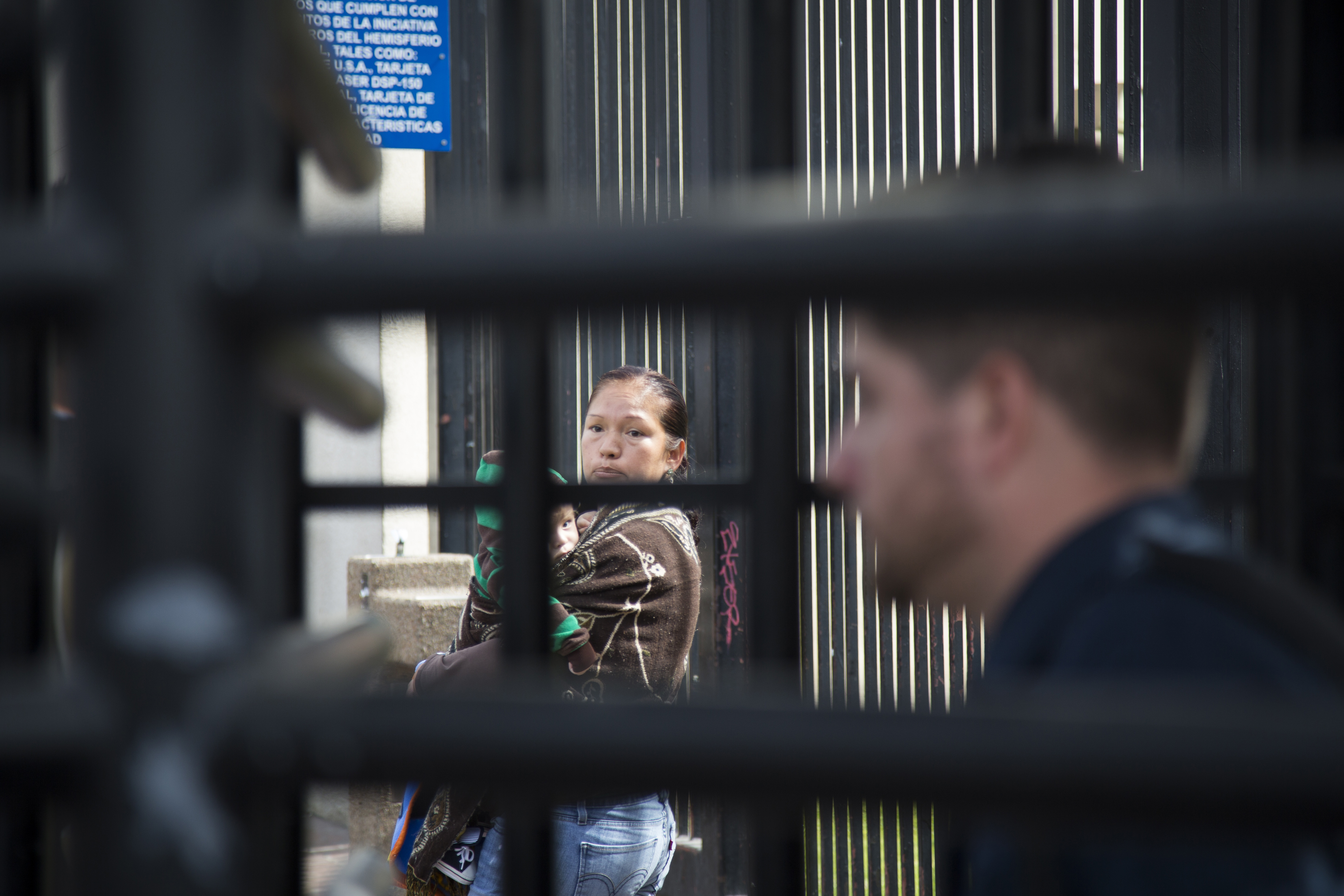 Immigrant rights activist Elvira Arellano leads the way through the metal turnstyle into the United States where she planned to ask for asylum in Tijuana, Mexico, Tuesday, March 18, 2014.   Arellano and another 20 Mexican and Central American migrants crossed into the United States from the border city of Tijuana as part of a protest to demand an overhaul of U.S. immigration laws and an end to deportations.  () (AP Photo/Alex Cossio)