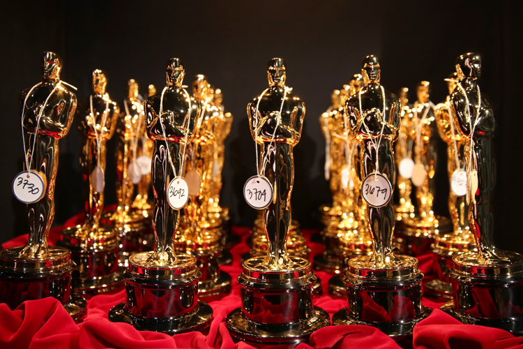 Oscar statues are lined up backstage during the Oscars at the Dolby Theatre, March 2, 2014. (AP/Matt Sayles)
