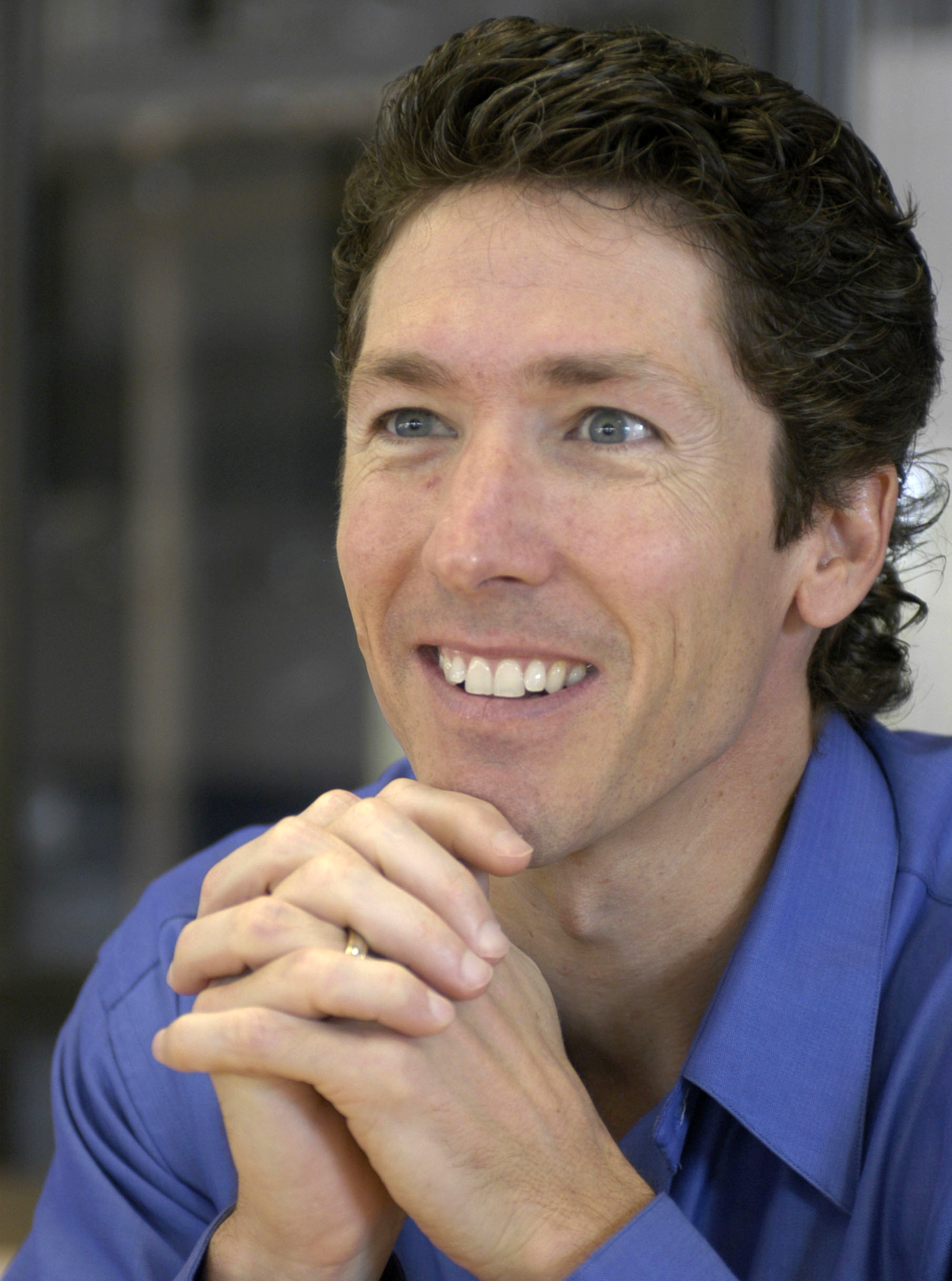 FILE - Lakewood Church pastor Joel Osteen smiles during an interview in the former basketball arena that has become the new home for the church in Houston, in this  Sept. 20, 2004, file photo. Authorities are investigating after $600,000 in checks and cash was stolen from a safe at Pastor Joel Osteen's Houston megachurch, which has one of the largest congregations in the country. Police spokesman Kese Smith said Tuesday March 11, 2014 $200,000 in cash and $400,000 in checks were stolen from a safe sometime between 2:30 p.m. Sunday and 8:30 a.m. Monday. (AP Photo/Pat Sullivan) (AP Photo/Pat Sullivan)