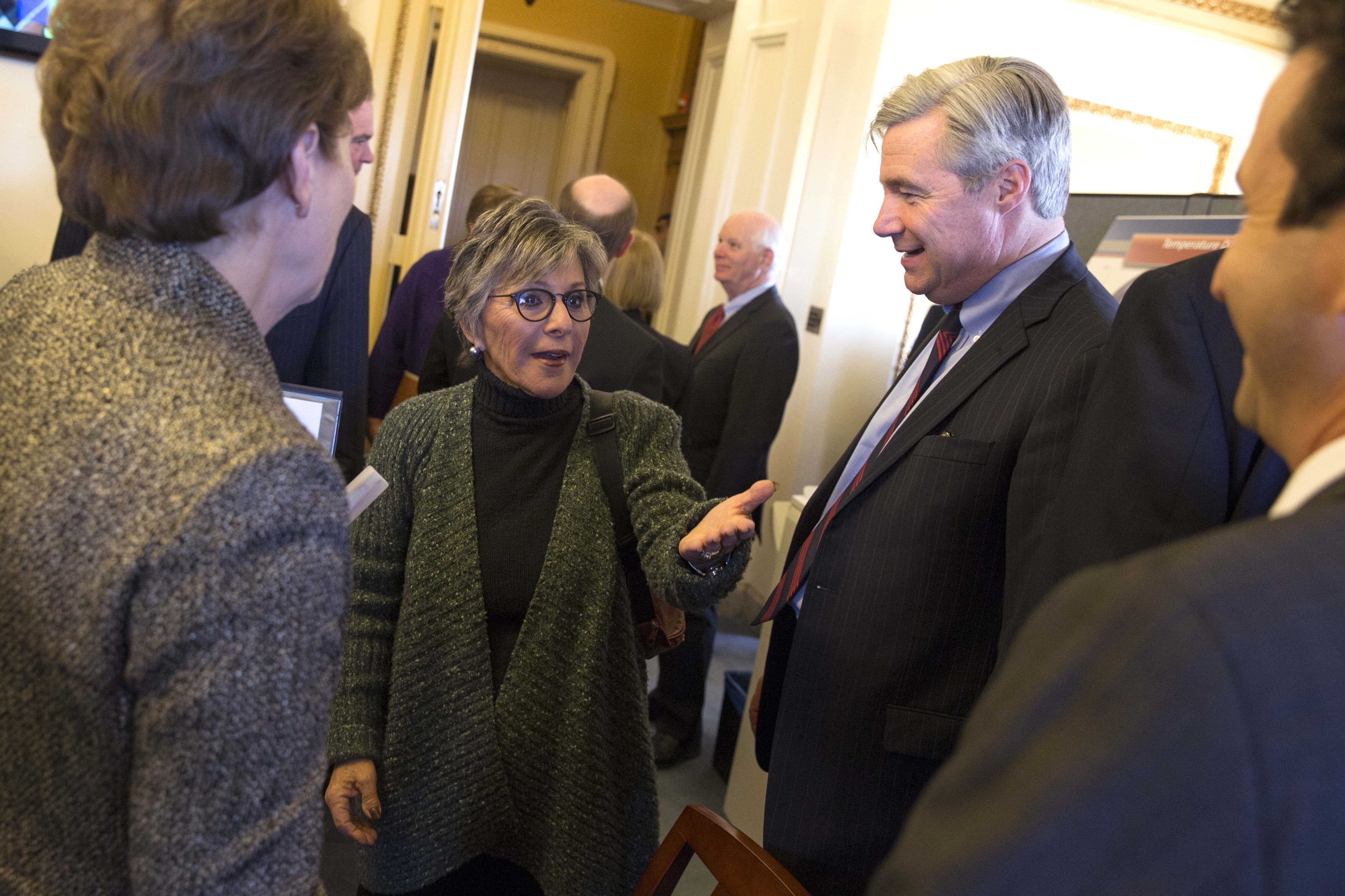 Senate Environment and Public Works Committee Chairman Sen. Barbara Boxer, D-Calif., talks with Senators during a meeting of the Senate Climate Action Task Force prior to taking to the Senate Floor all night to urge action on climate change on Capitol Hill on Monday, March 10, 2014, in Washington. From left, Sen. Jeanne Shaheen, D-N.H, Boxer, Sen. Sheldon Whitehouse, D-R.I., and Sen. Brian Schatz, D-Hawaii. (AP Photo/ Evan Vucci)