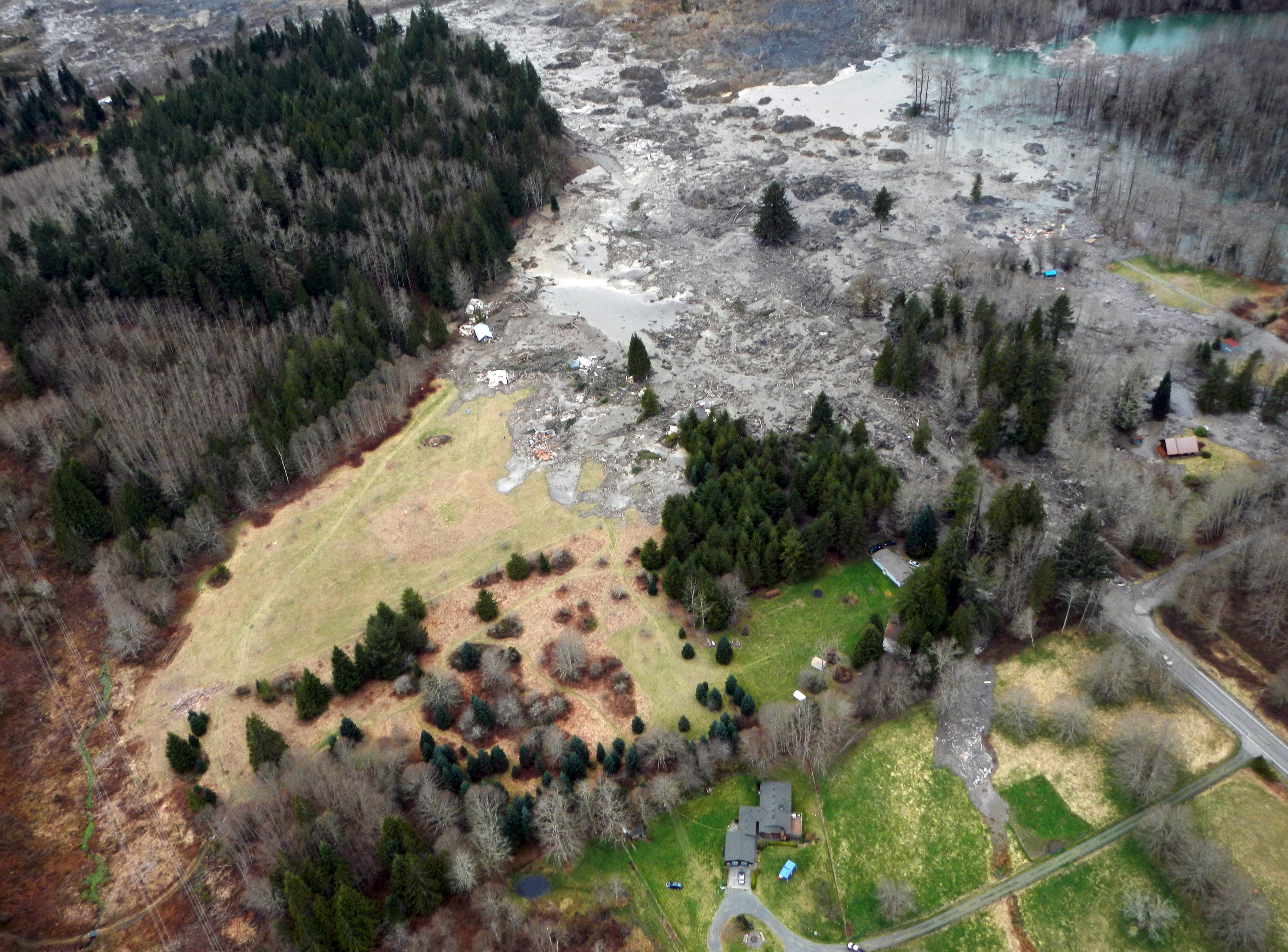 This March 23, 2014 photo, made available by the Washington State Dept of Transportation shows a view of the damage from Saturday's mudslide in Oso, Wash. (AP Photo/Washington State Dept of Transportation)