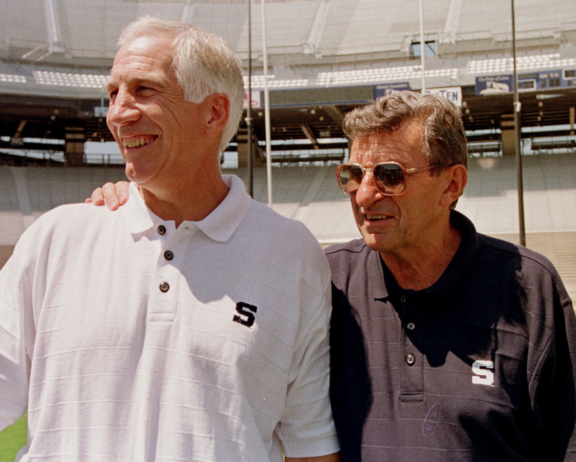Penn State head football coach Joe Paterno, right, poses with his defensive coordinator Jerry Sandusky (AP)