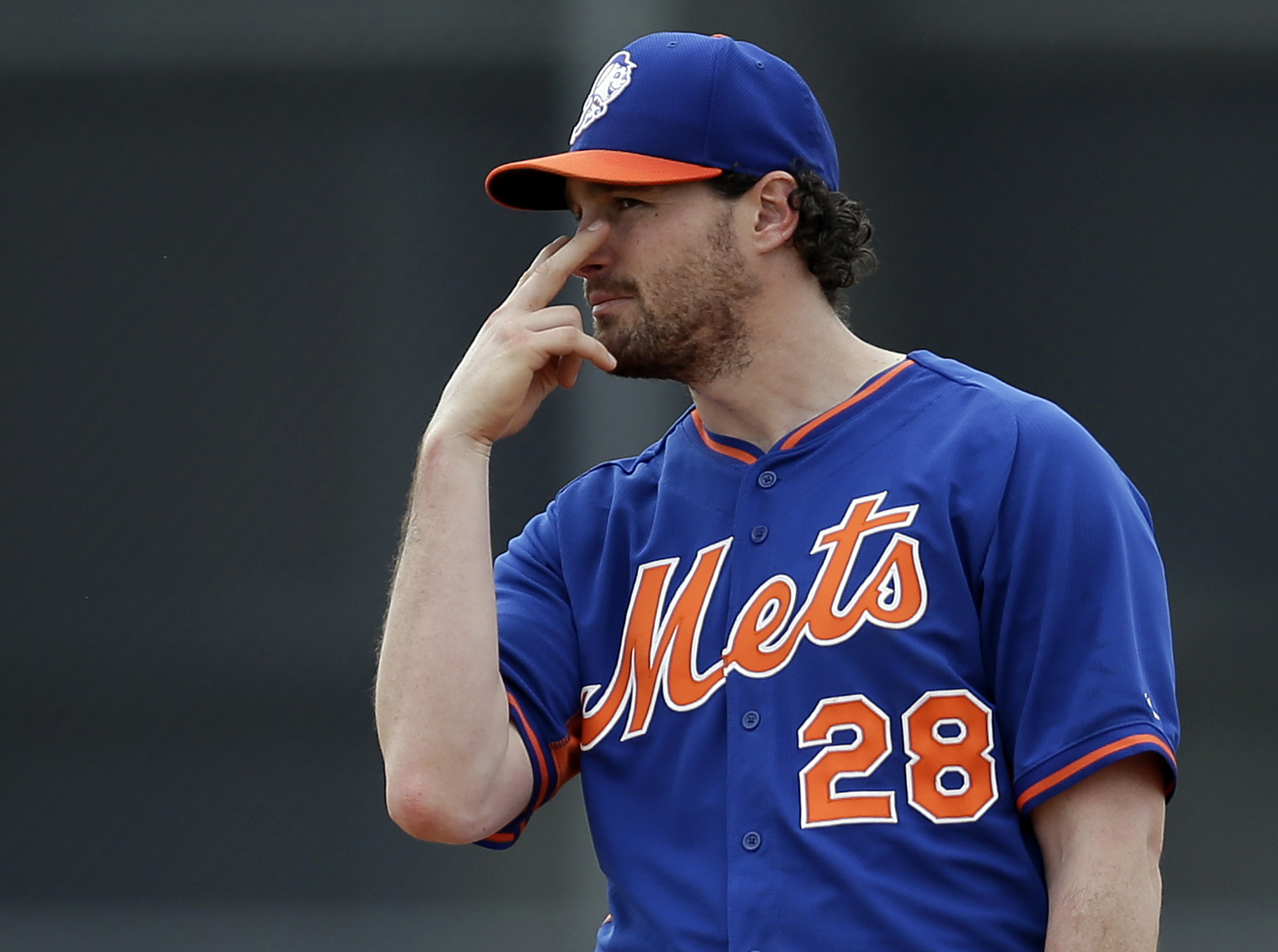 New York Mets infielder Daniel Murphy signals to a teammate during spring training baseball practice Saturday, Feb. 22, 2014, in Port St. Lucie, Fla. (AP)
