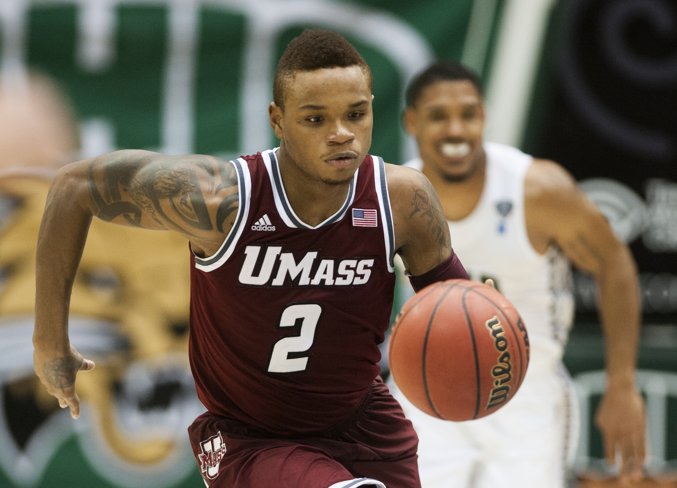 FILE - In this Dec. 18, 2013 file photo, Massachusetts guard Derrick Gordon (2) makes his way downcourt against Ohio in the second half of an NCAA college basketball game in Athens, Ohio. Gordon says in a televised interview that he is gay. Gordon made the announcement on ESPN on Wednesday, April 9, 2014, becoming the first openly gay player in Division I men's basketball. (AP Photo/Ty Wright, File) (Associated Press)