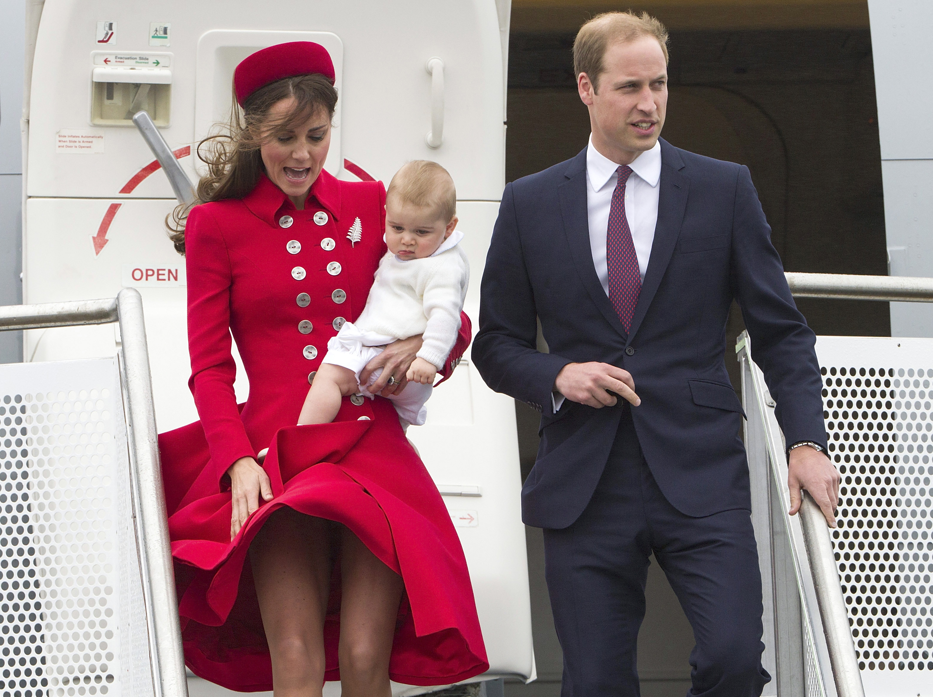 Britain's Prince William and his wife Kate, the Duchess of Cambridge with Prince George arrive for their visit to New Zealand at the International Airport, in Wellington, New Zealand, Monday, April 7, 2014. (AP Photo/SNPA, David Rowland) NEW ZEALAND OUT (AP)