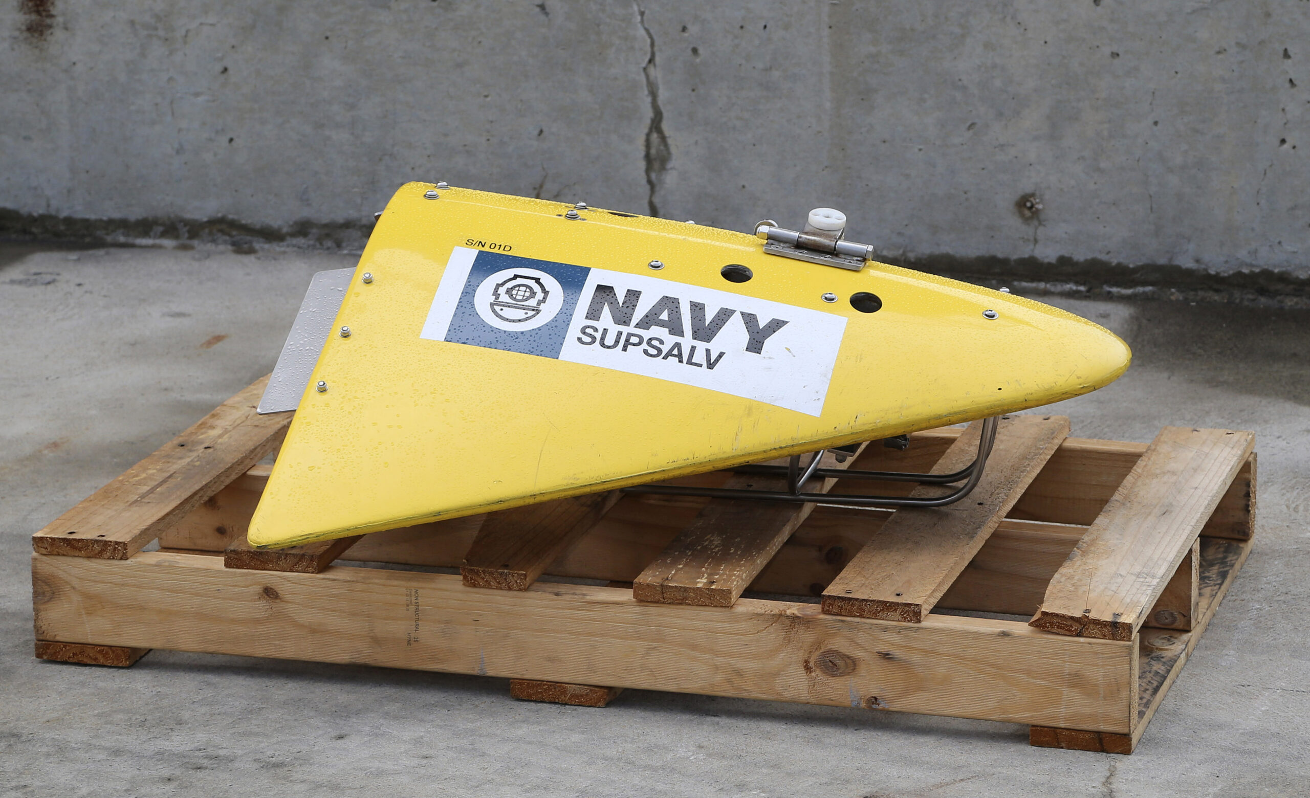 CORRECTS IDENTIFICATION OF EQUIPMENT TO A TOWED PINGER LOCATOR - A Towed Pinger Locator (TPL), used to detect black box recorders, sits on the wharf at naval base HMAS Stirling in Perth, Australia, ready to be fitted to the Australian warship Ocean Shield to aid in the search for missing Malaysia Airlines Flight MH370, Sunday, March 30, 2014. The Australian Maritime Safety Authority, which oversees the search, said the ship will be equipped with the TPL, an unmanned underwater vehicle, and other acoustic detection equipment. (AP Photo/Rob Griffith) (Rob Griffith)