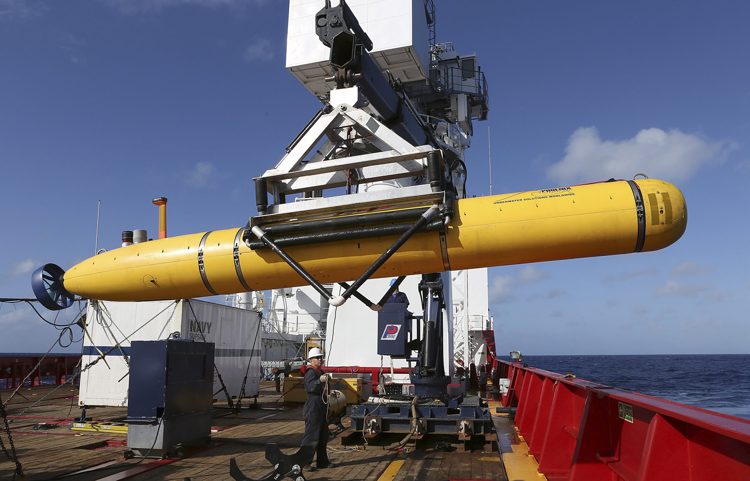 In this Thursday, April 17, 2014 photo provided by the Australian Defence Force the Phoenix International Autonomous Underwater Vehicle (AUV) Artemis is craned over the side of Australian Defence Vessel Ocean Shield before launching the vehicle in to the southern Indian Ocean in the search of the missing Malaysia Airlines Flight 370Malaysia Airlines MH370. Up to 11 aircraft and 12 ships continue to scan the ocean surface for debris from the Boeing 777 that disappeared March 8 en route from Kuala Lumpur to Beijing with 239 people on board. (AP Photo/Australian Defence Force, Bradley Darvill) EDITORIAL USE ONLY (Lsis Bradley Darvill)