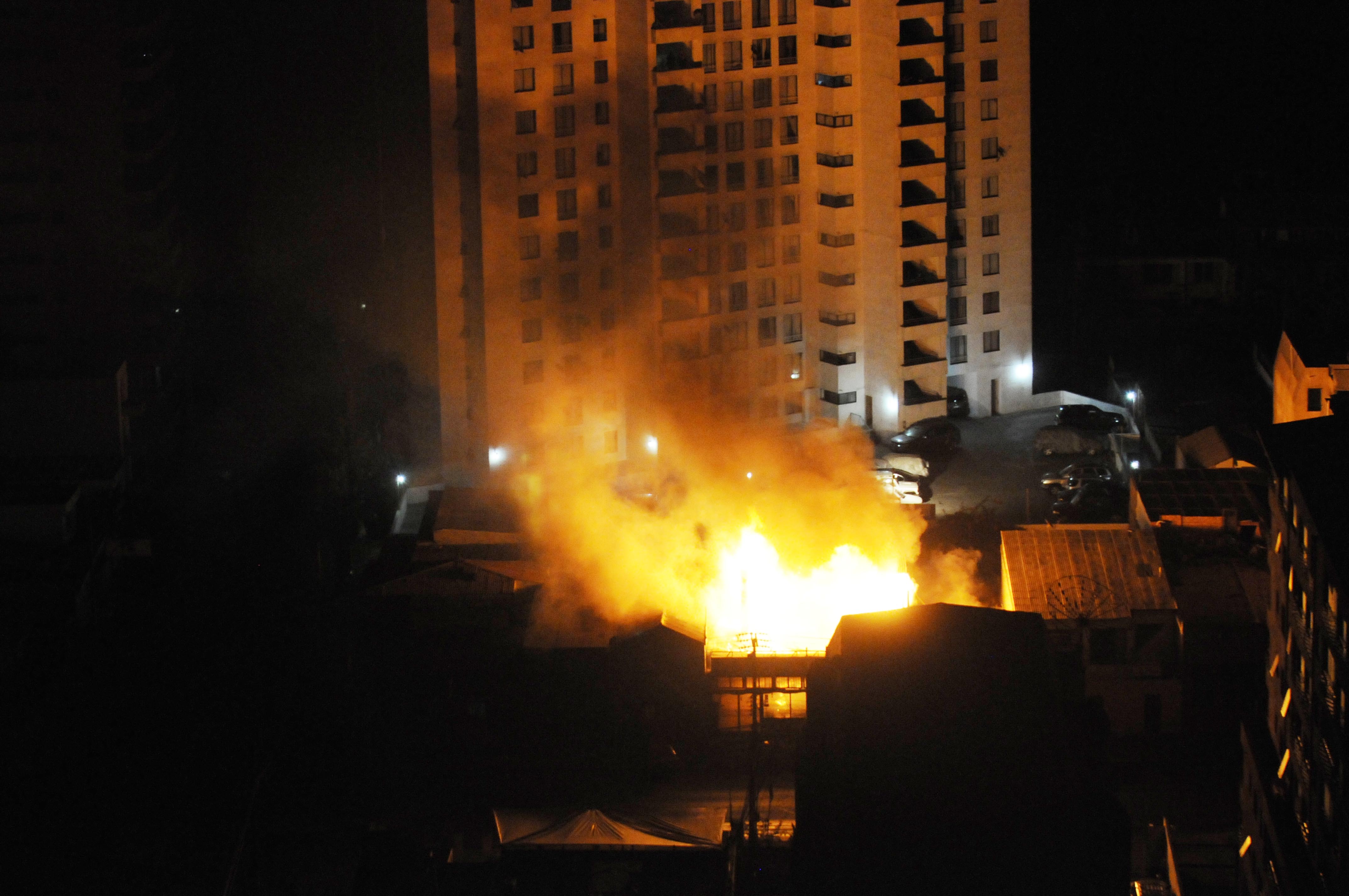 A fire burns at a restaurant after an earthquake in Iquique, Chile, Tuesday, April 1, 2014. A powerful magnitude-8.2 earthquake struck off Chile's northern coast Tuesday night. (AP Photo/Cristian Viveros)