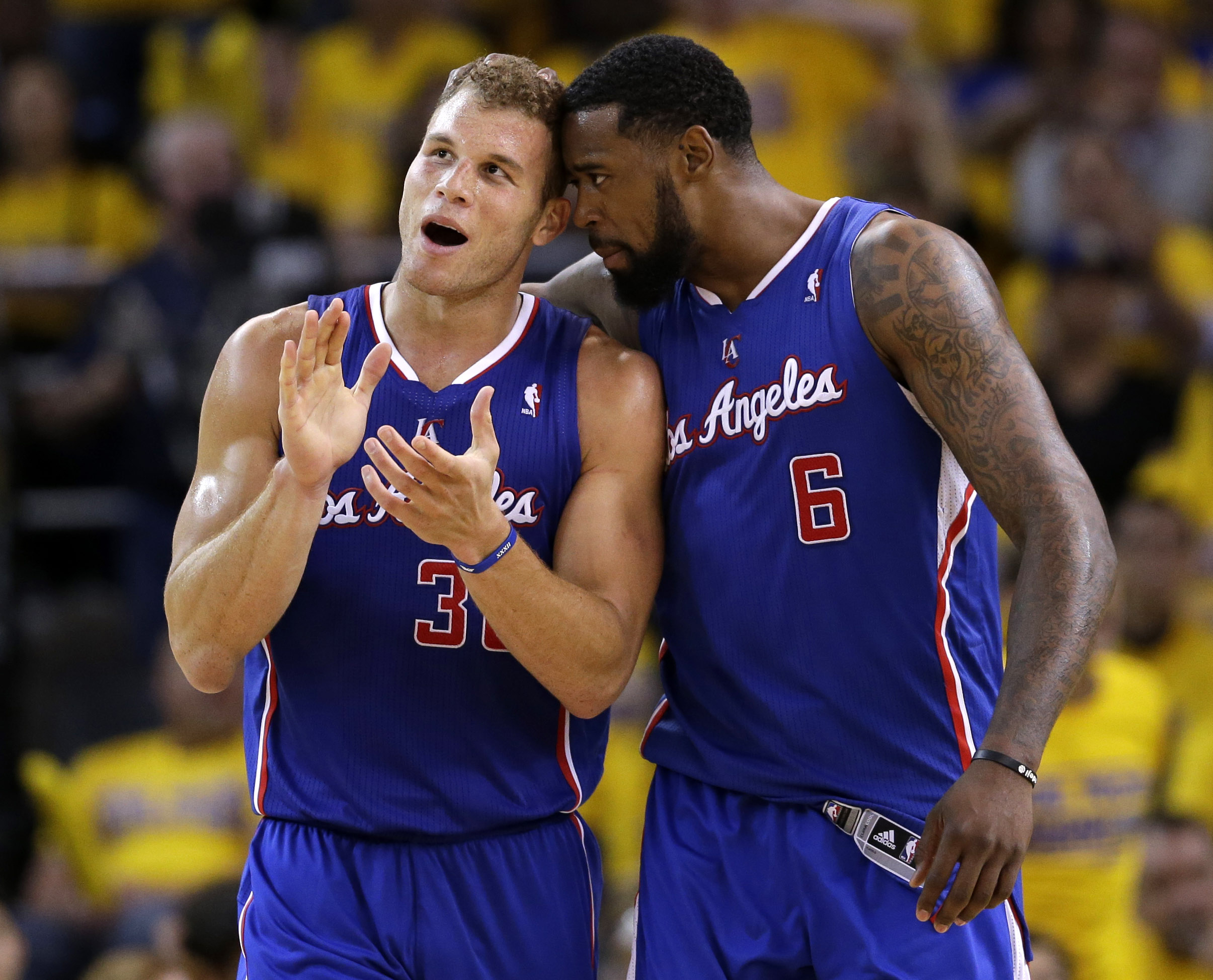 FILE - In this April 24, 2014 file photo, Los Angeles Clippers' Blake Griffin (32) celebrates with teammate DeAndre Jordan (6) after Griffin drew a fragrant foul during the second half in Game 3 of an opening-round NBA basketball playoff series against the Golden State Warriors in Oakland, Calif. Griffin and Jordan are finally performing in a place they haven't always flourished _ in the playoffs and in the most crucial moments. (AP Photo/Marcio Jose Sanchez, File) (AP)
