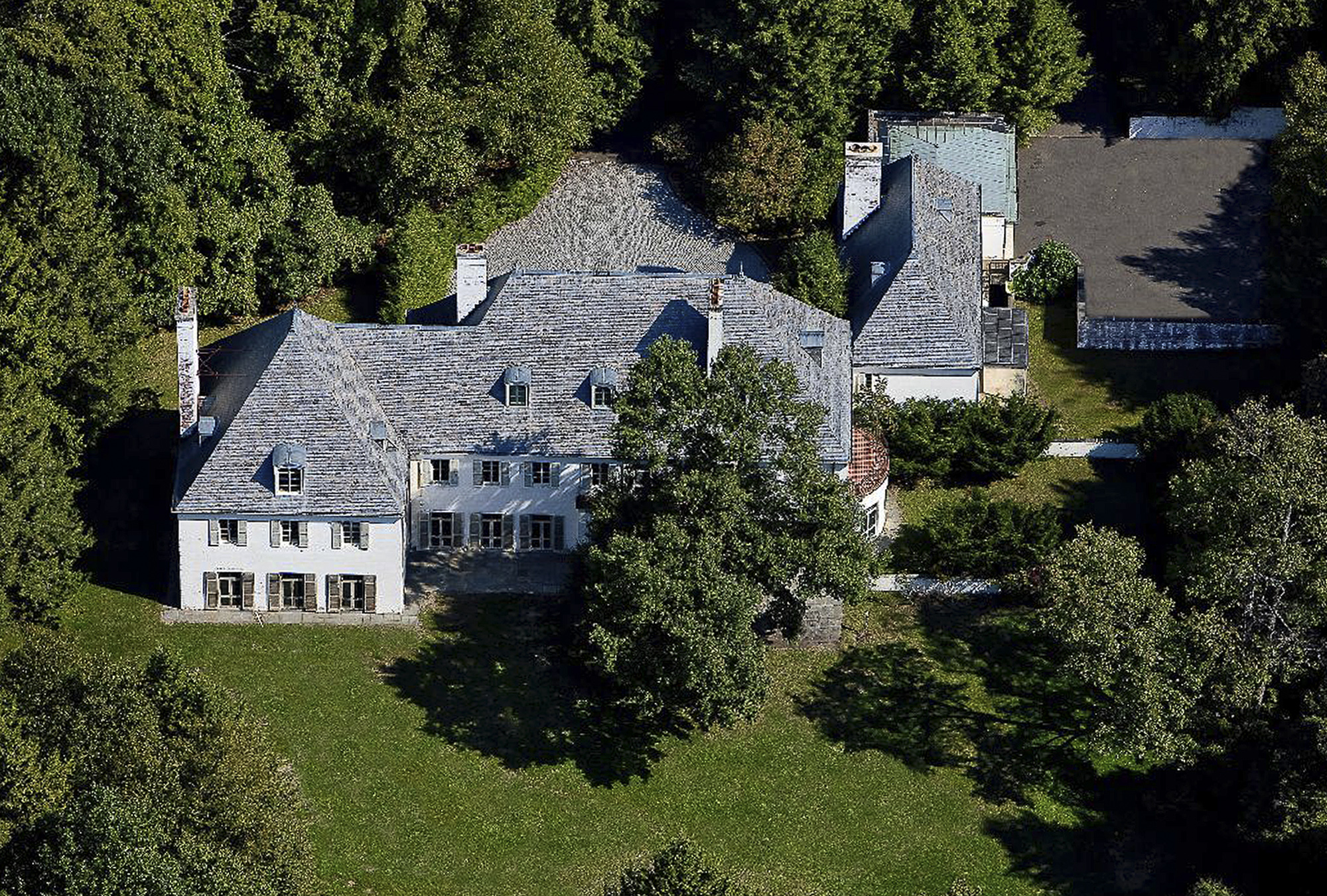 This undated photo provided by Barbara Cleary's Realty Guild shows the rear view of a 52-acre estate that sold for $14.3 million on Monday, April 14, 2014, in New Canaan, Conn. (AP Photo/Barbara Cleary's Realty Guild) (AP)