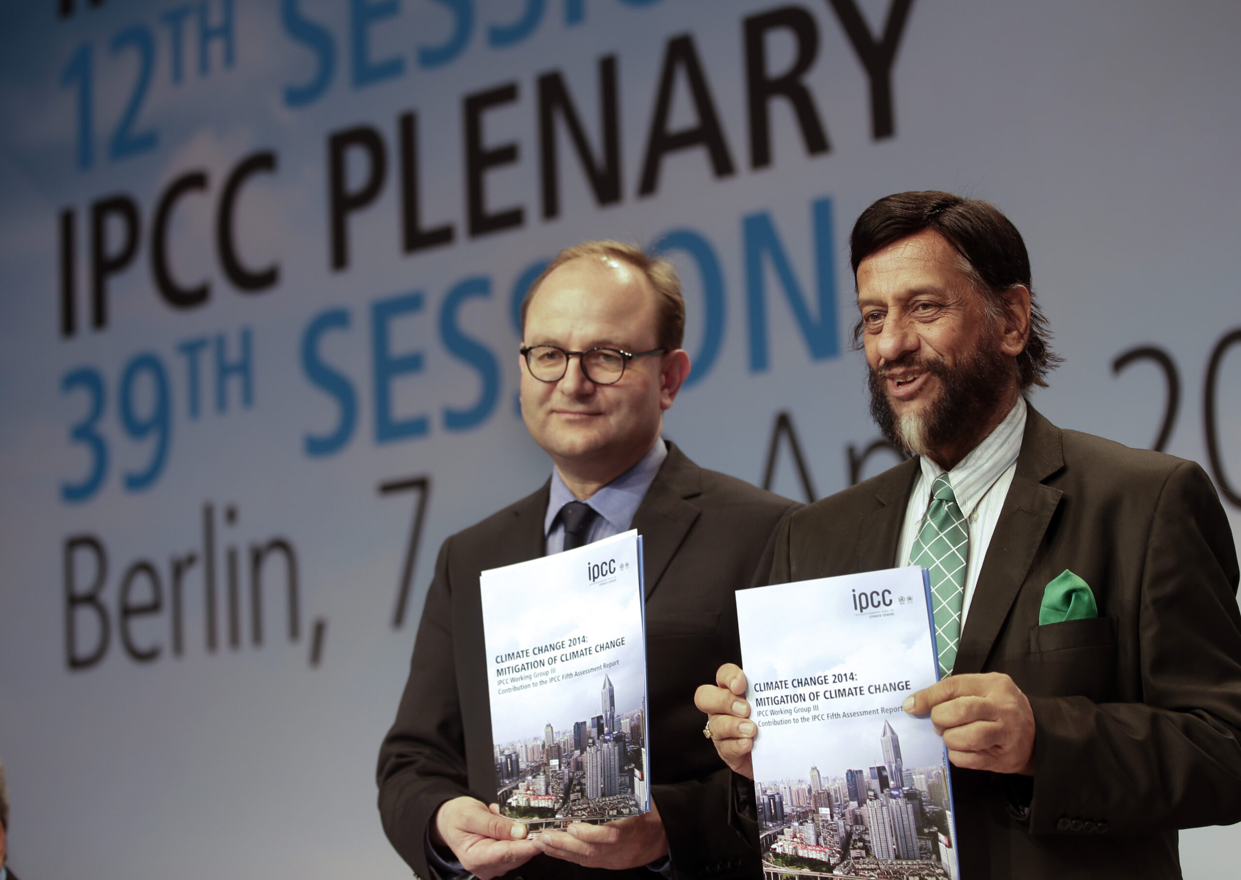 Ottmar Edenhofer, Co-Chairman of the IPCC Working Group III, and Rejendra K. Pachauri, Chairman of the IPCC, from left, pose prior to a press conference as part of a meeting of the Intergovernmental Panel on Climate Change (IPCC) in Berlin, Germany, Sunday, April 13, 2014. (AP/Michael Sohn)
