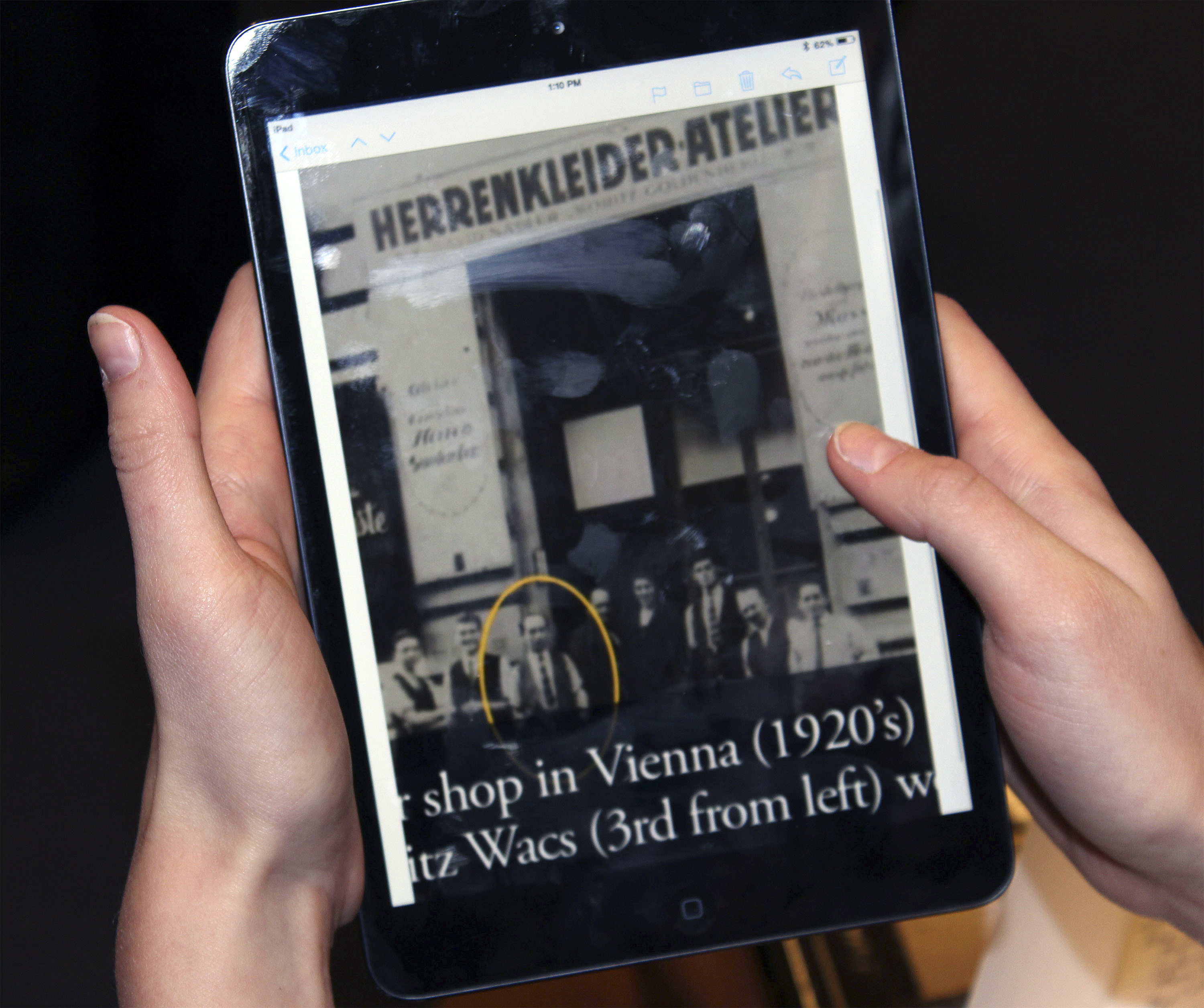 In this Jan. 27, 2014 photo provided by Jane Rohman, an image on a tablet screen at the Simon Wiesenthal Museum of Tolerance in New York, showing Moritz Wacs, circled, posing for a photo with others in Vienna, Austria in the 1920's. University of New Haven students are working on a daunting assignment: Who was the suspected Nazi who protected Wacs and his Jewish family 75 years ago from violence, and warned them to flee Austria just before World War II broke out? (AP Photo/Jane Rohman) (AP)