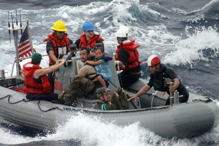 The U.S. Coast Guard assists in the rescue of the Kaufman family, Sunday, April 6, 2014. (AP)