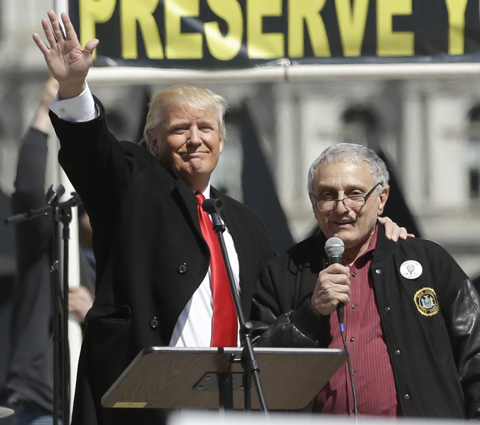 Donald Trump, left, and Carl Paladino, who ran for governor of New York as a Republican in 2010, speak during a gun rights rally at the Empire State Plaza on Tuesday, April 1, 2014, in Albany, N.Y. Activists are seeking a repeal of a 2013 state law that outlawed the sales of some popular guns like the AR-15. The law championed by Gov. Andrew Cuomo has been criticized as unconstitutional by some gun rights activists. (AP Photo/Mike Groll) (AP)