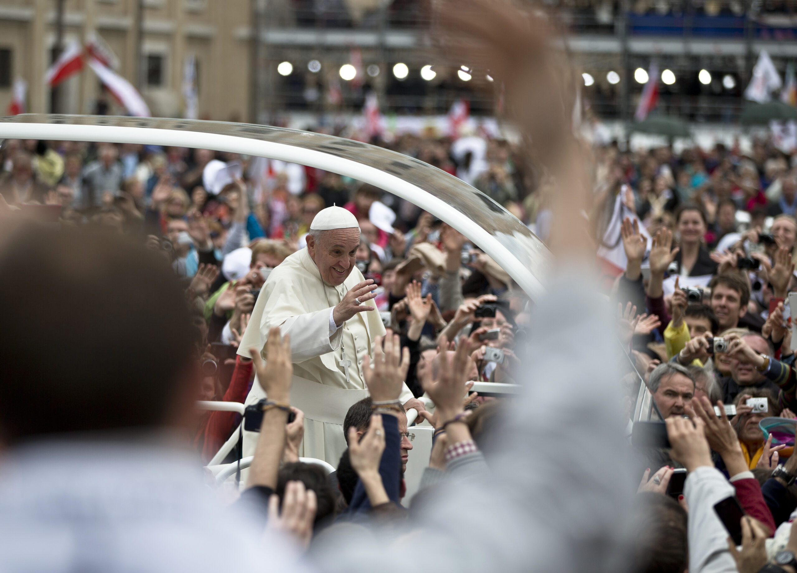 Pope Francis is driven through the crowd in St. Peter's Square at the Vatican, Sunday, April 27, 2014. Pope Francis has declared his two predecessors John XXIII and John Paul II saints in an unprecedented canonization ceremony made even more historic by the presence of retired Pope Benedict XVI. (AP Photo/Vadim Ghirda) (Vadim Ghirda)
