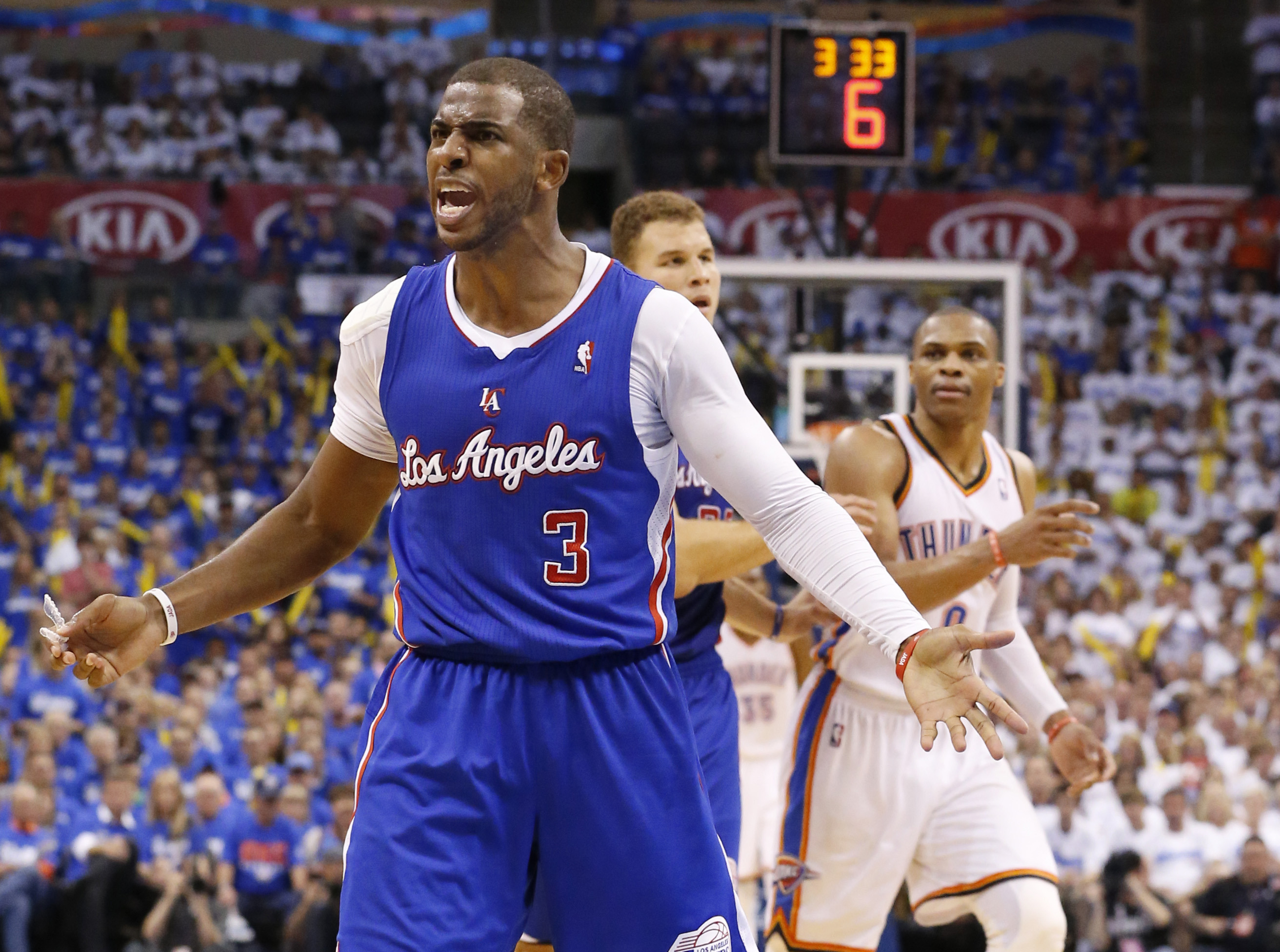 Los Angeles Clippers guard Chris Paul (3) complains to an official in front of Oklahoma City Thunder guard Russell Westbrook (0) in the third quarter of Game 2 of the Western Conference semifinal NBA basketball playoff series in Oklahoma City, Wednesday, May 7, 2014. Oklahoma City won 112-101. (AP Photo/Sue Ogrocki) (AP)