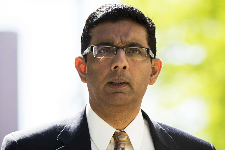 Dinesh D'Souza exits the Manhattan Federal Courthouse after pleading guilty in New York, May 20, 2014. (Reuters/Lucas Jackson)